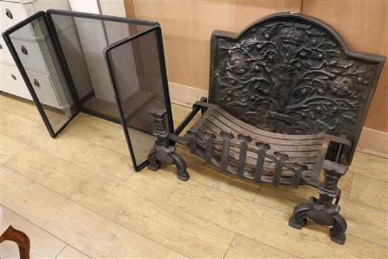 A pair of fire dogs, a fire basket and iron fire back and spark guard fire back W.84cm
